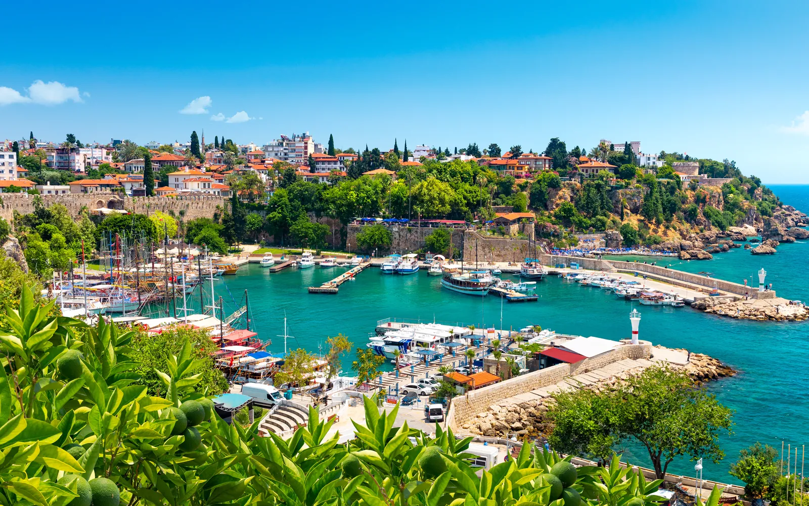 The old harbour at Kaleiçi in Antalya, with boats moored below Ottoman houses