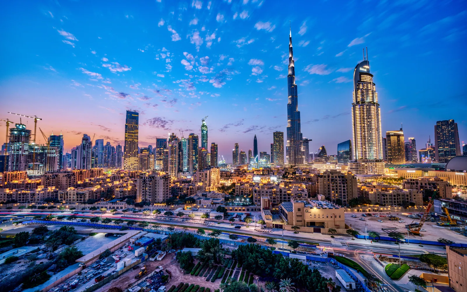 Downtown Dubai at dusk with the Burj Khalifa and surrounding towers