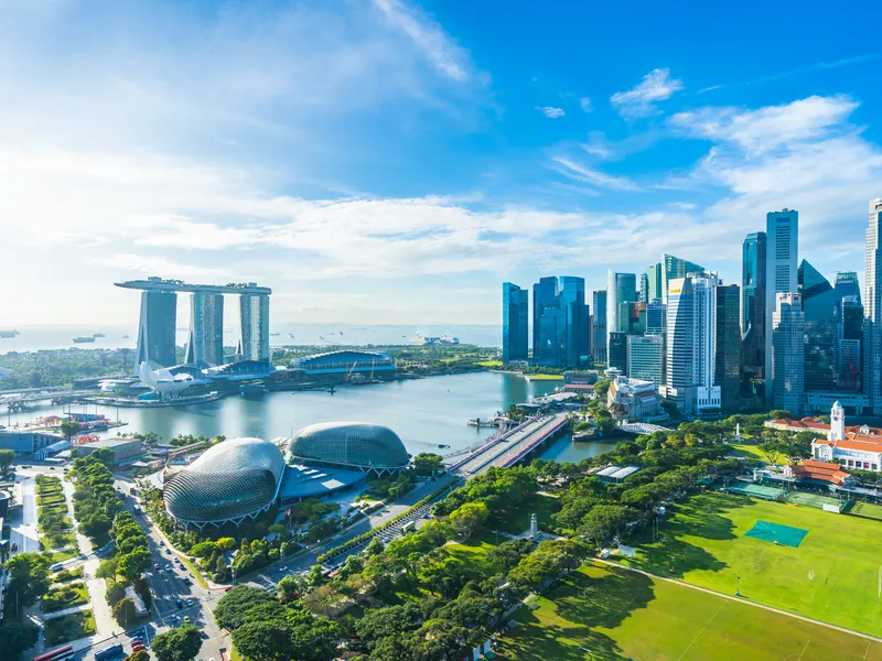 Singapore from the air in daylight, towers around the green bay