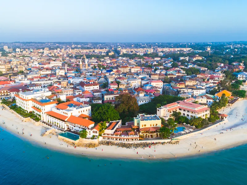 The rooftops of Stone Town from the air, the sea beyond