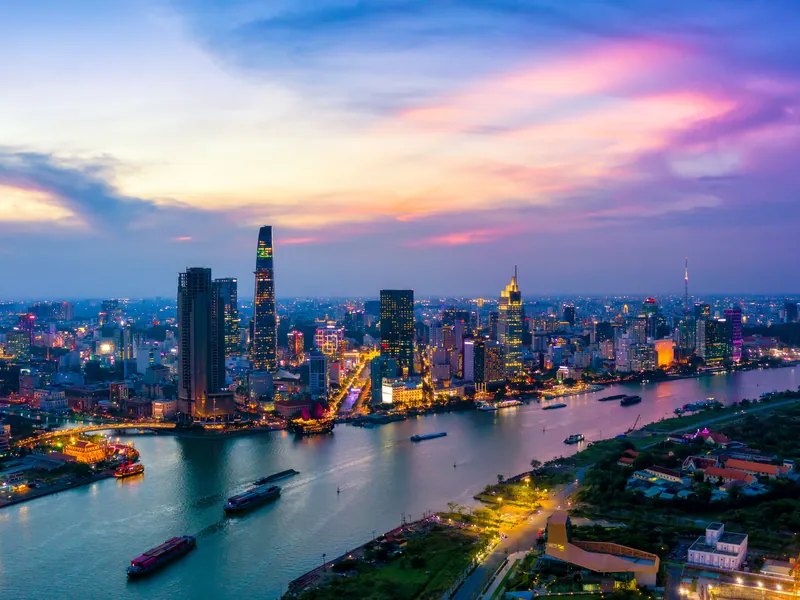 Ho Chi Minh City at dusk, towers along the river